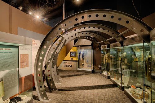 Section of the military exhibit with uniforms and artifacts in cases