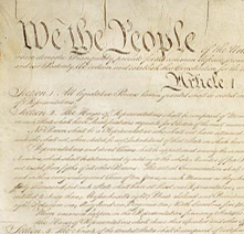 Magnification of the US Constitution showing the words We the People