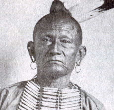 Osage Chief Pawhuska looks directly at the camera.