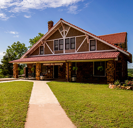 A pathway leading to the two story home of Pawnee Bill.
