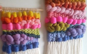 Woven wall hangings with looping and tight stiches.