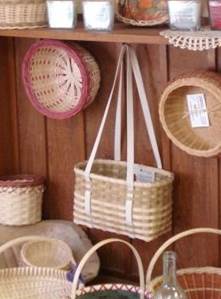 several baskets hanging on a wood-paneled wall