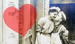A man kissing a woman on the steps to a home.