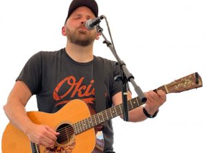 Riley Jantzen sings and plays guitar.