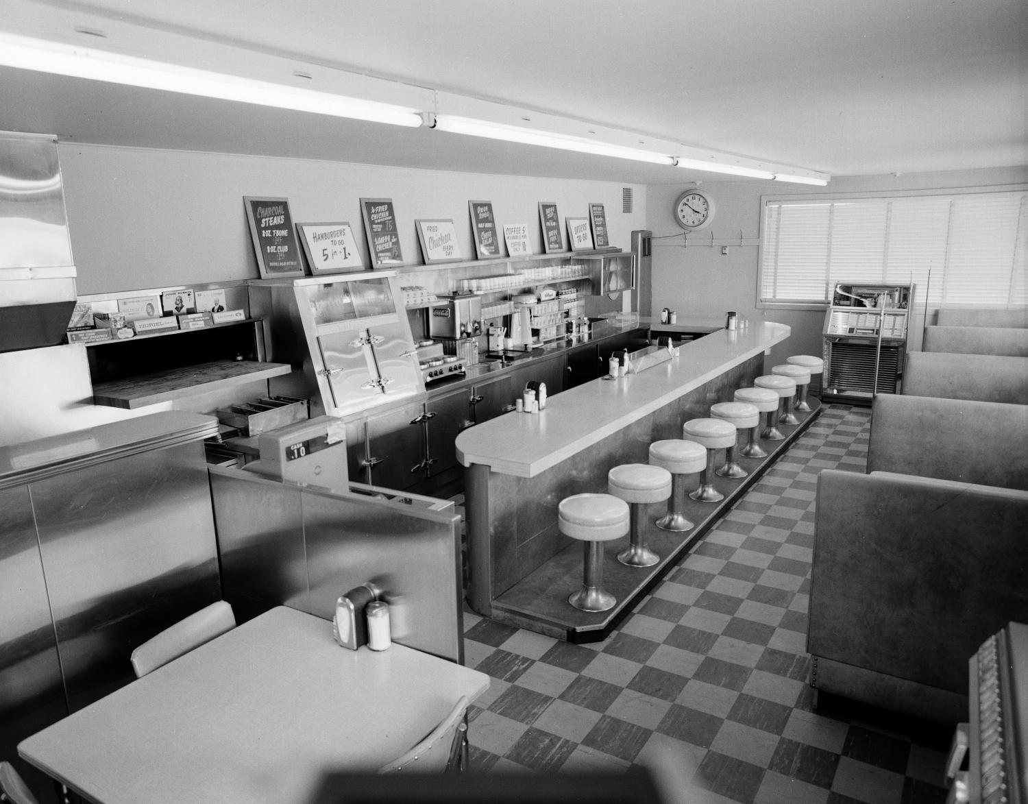 Historic black-and-white photograph of an empty diner