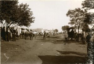 Freedmen walk along the encampment at Fort Gibson in preparation for joining the Dawes Rolls.