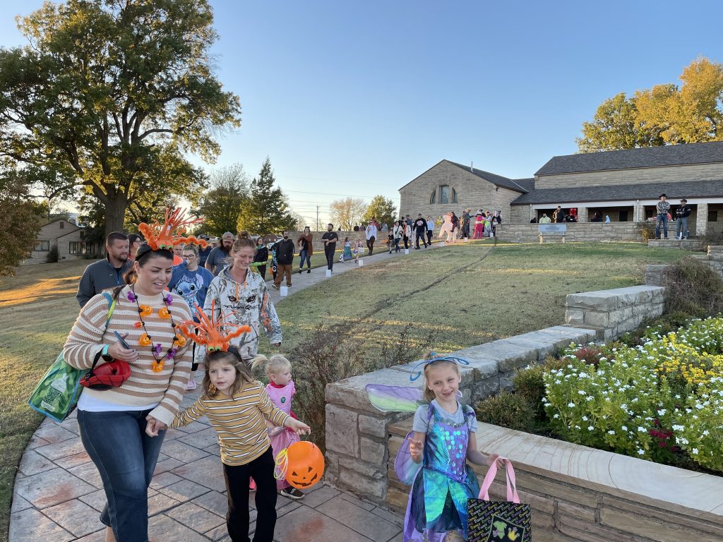 Trick or Treaters line the walkway at the Will Rogers Memorial Museum.
