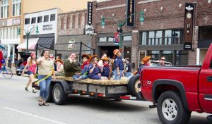 A group of scouts and parents in the Will Rogers Days parade in downtown Claremore.
