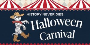 A mummy dressed as a cowboy under carnival tents