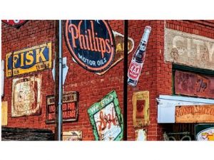 A store in Erick Oklahoma displaying many different metal sign advertisements from a bygone era.