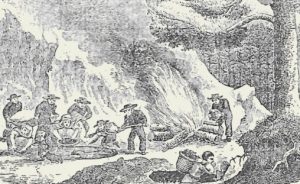 Men tend a fire and set up camp.