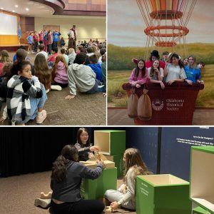 Schoolchildren group together to hear a volunteer speak. Highschool students take a photo in the Hot Air Balloon prop. Children play with large stacking blocks at the Museum.