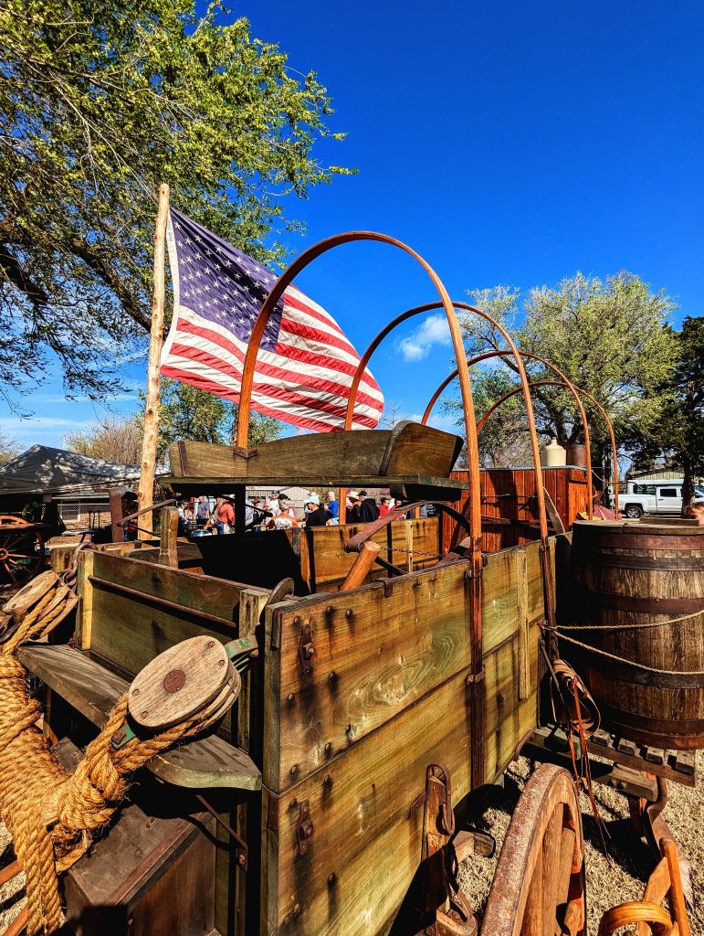 A chuck wagon flies an American flag.
