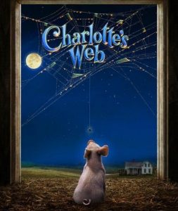 A small pig looks up at the night sky with a full moon, with its nose pointing to Charlotte, a spider dangling from a large web in the barn doorway.