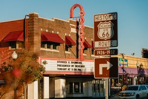 Circle Cinema and the Historic Route 66 sign in the foreground.