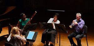 OAI Faculty members play various instruments.