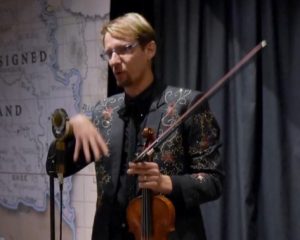 Musician Kyle Dillingham speaks to an audience.