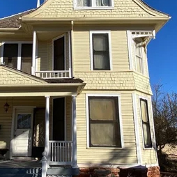 Detail of siding and Victorian gingerbread house details.