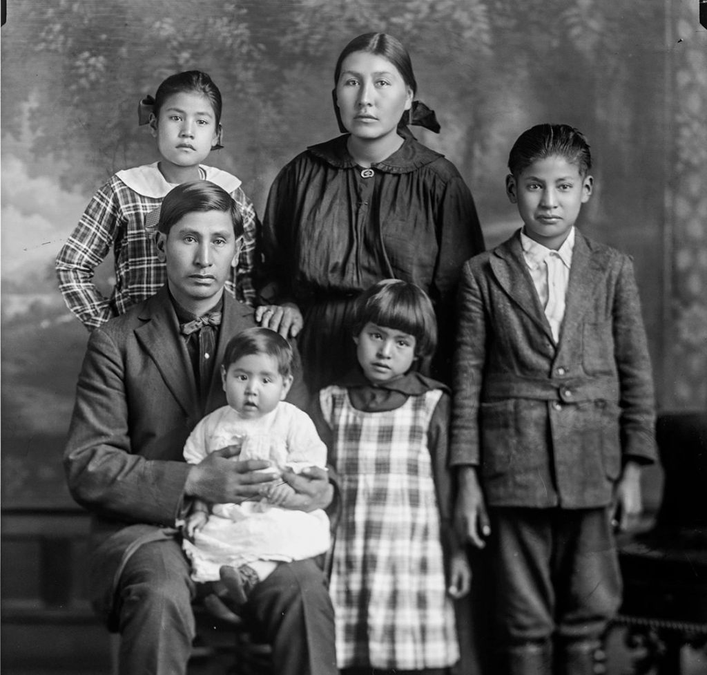 A family portrait with four children.