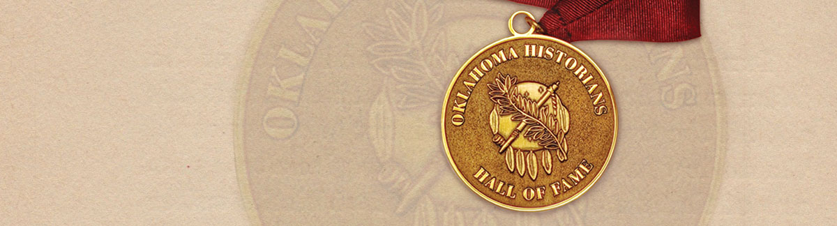 The gold-colored Oklahoma Historians Hall of Fame medallion on deep red ribbon