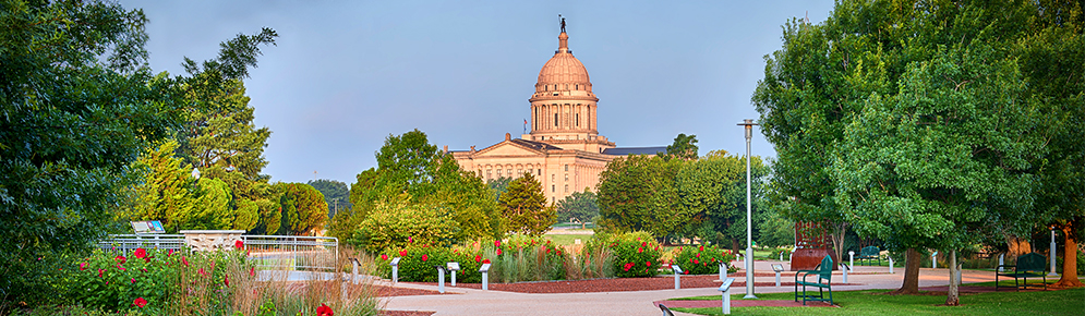 The Red River Journey includes colorful flowers, lush trees, and a view of the Capitol