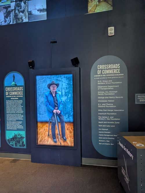 A large video screen in an exhibit