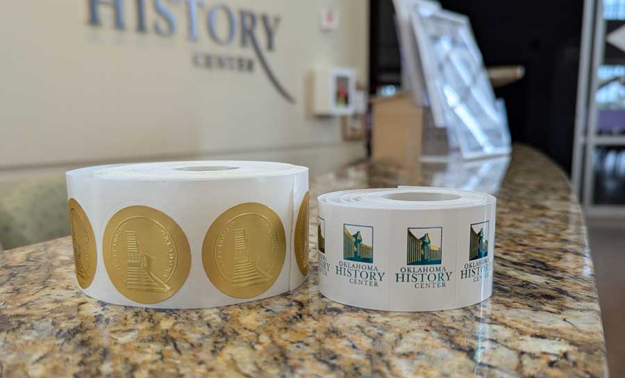 Rolls of stickers with the History Center logo
