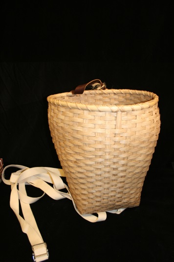 A simple basket with straps held clothing.