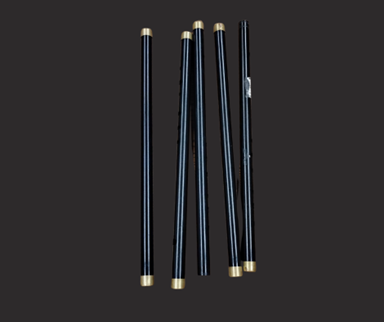Five black fifes with a gold-colored metal tip on each end.