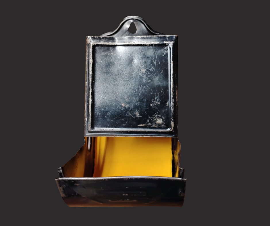 A metal container with a tray extending from the bottom. 