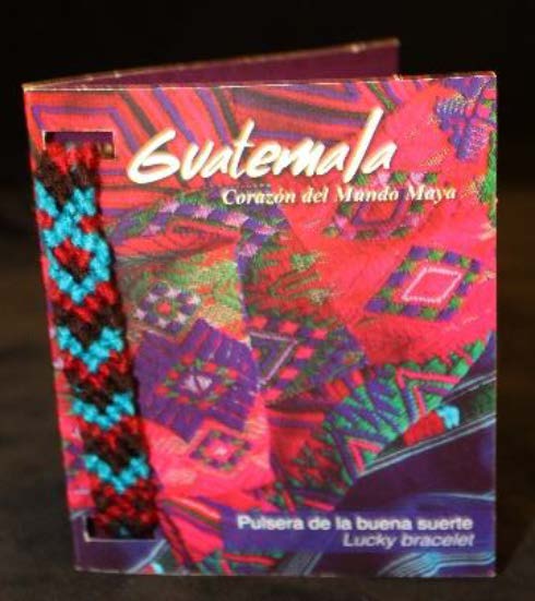 A book with a hand-woven friendship bracelet with a chevron pattern.