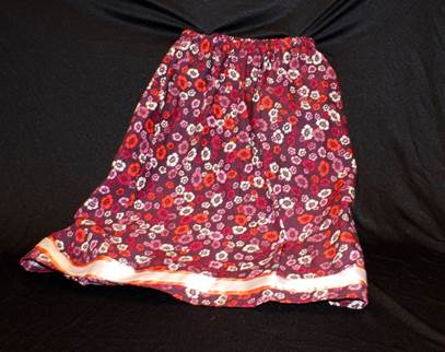 A simple skirt with pink and red flowers.