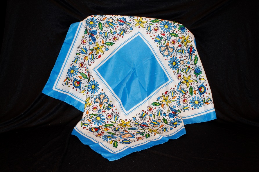 A scarf decorated with many small flowers and designs.