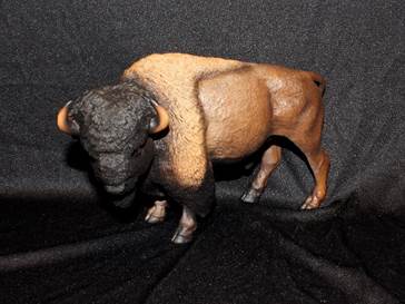 A small plastic bison figurine.