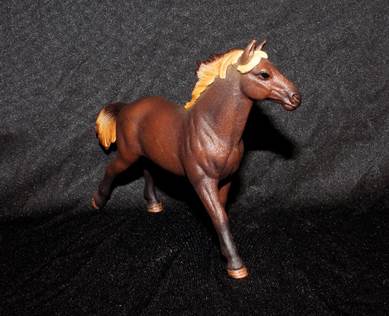A small plastic horse figurine.