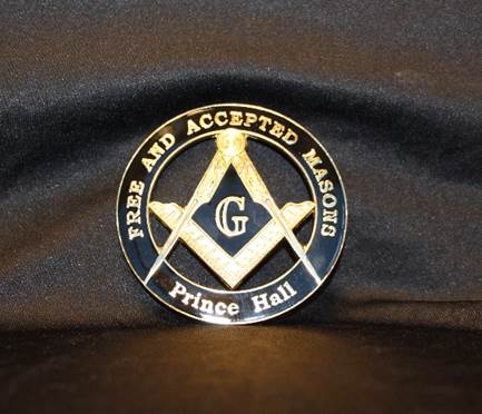 The medallion includes the text, Free and Accepted Masons Prince Hall. A compass and square are in the center. 