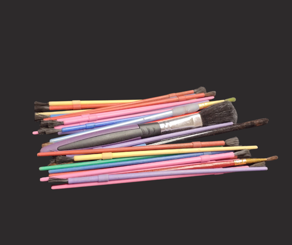 A pile of small paint brushes.