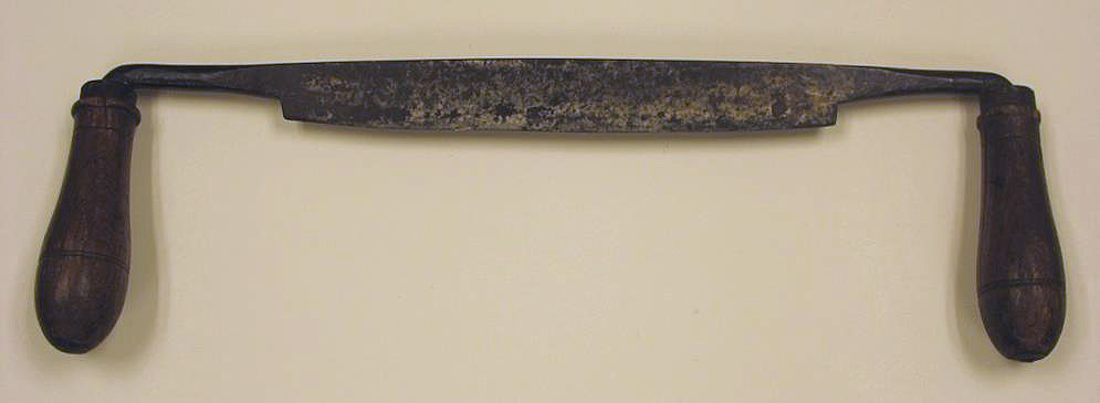 The saw has teeth in the middle, and handles on either side.