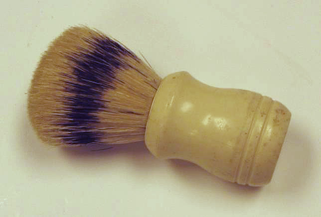 A short, fat brush with long bristles.