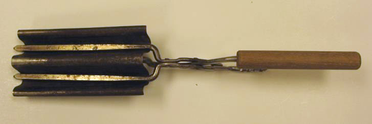 A tool with curved metal panels at the top and a wooden handle.