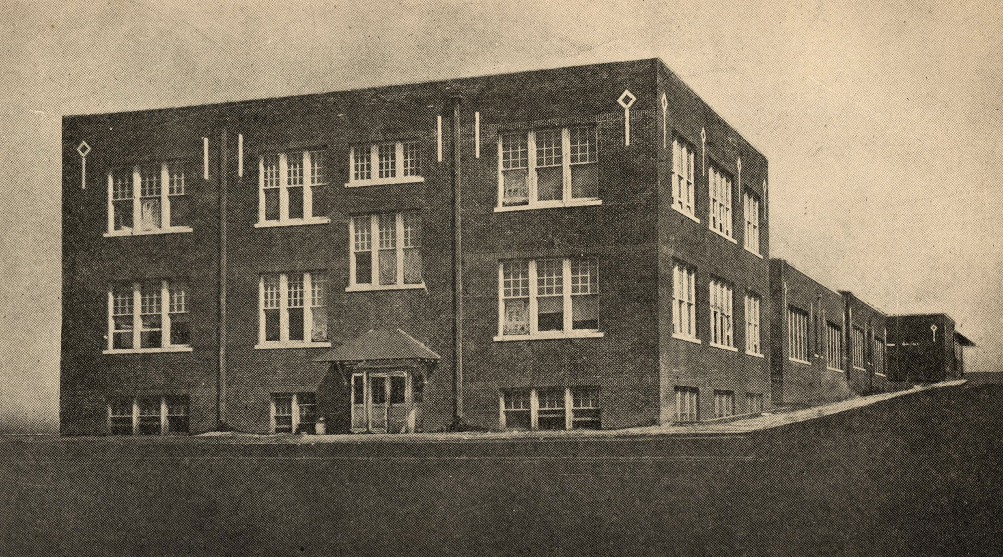 Foto da Escola Secundária Booker T. Washington, no distrito de Greenwood, 1920.