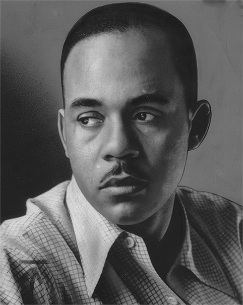 A close-up picture of an African American man in a dress suit, looking to the left.