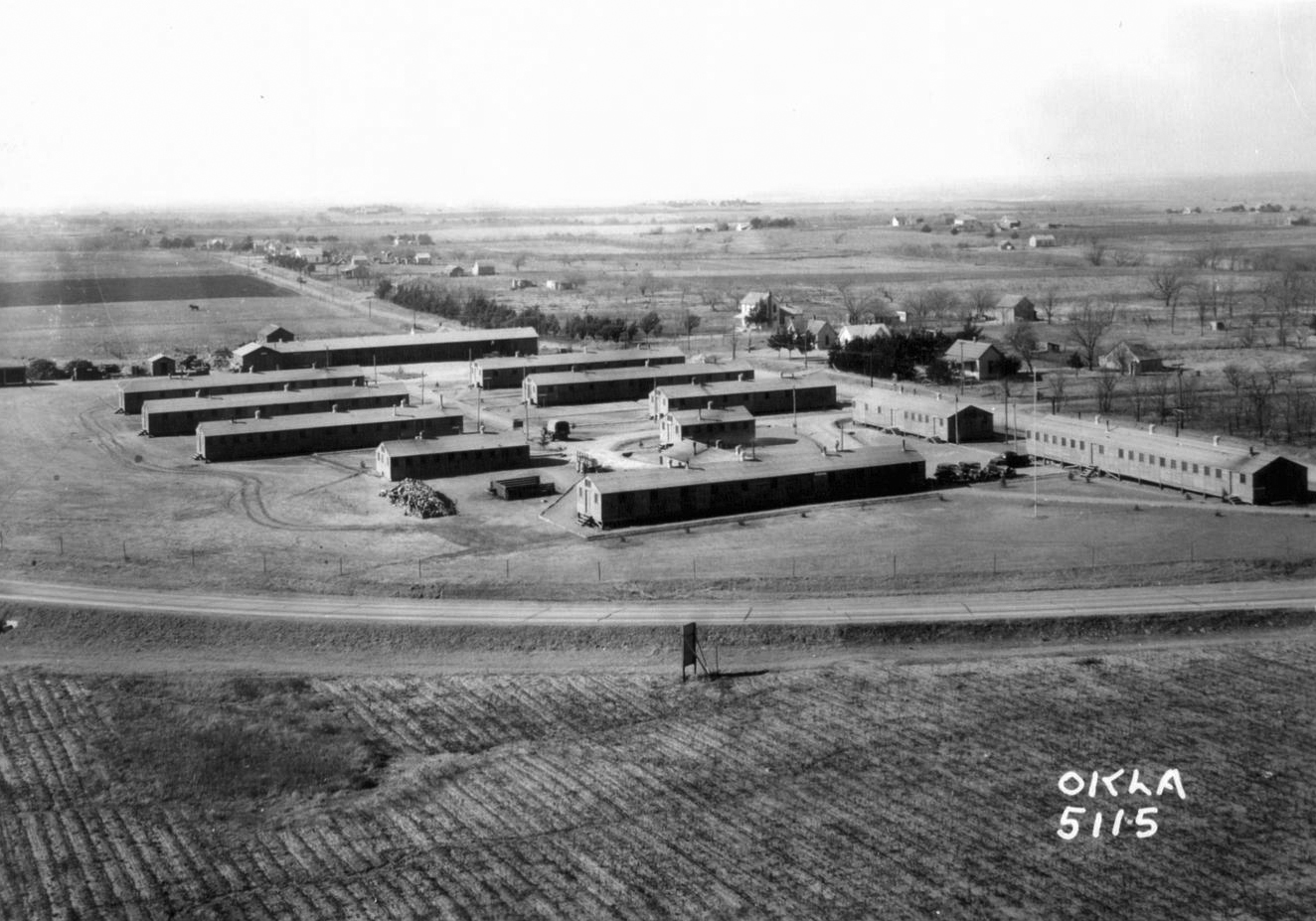 A long distance view of a number of long buildings. 