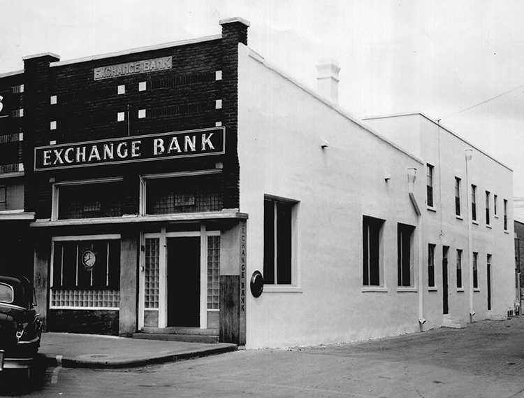 Small building with sign that says, 'Exchange Bank.'