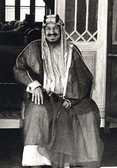 Ibn Saud seated, wearing traditional Otaibah dress 
