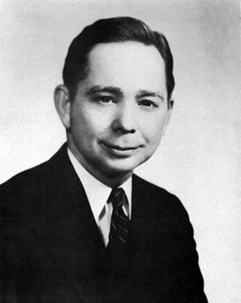 Headshot of Carl Albert wearing a suit and tie. 