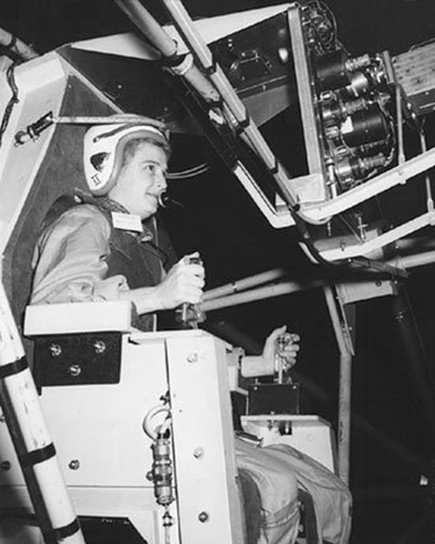 Cobb sits at the controls of the Multi-Axis Space Test Inertia Facility.