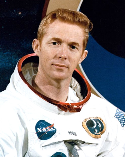 A portrait of Stuart Allen Roosa in his white flight suit