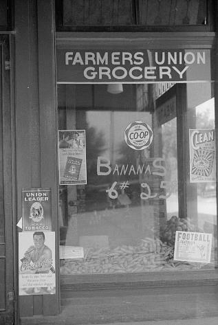 Storefront reading 'Farmers Union Grocery'
