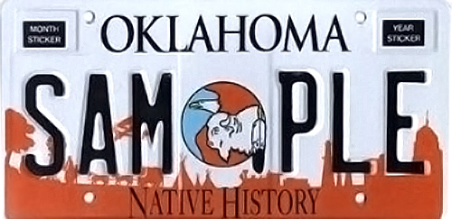 License plate with an illustration of a bald eagle and bison above reddish-brown silhouettes of of a landscape with tepees, trees, the capitol